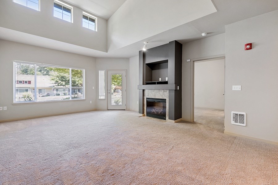 Living room with windows and fireplace