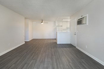 Living and dining area near kitchen with wood floors - Photo Gallery 4