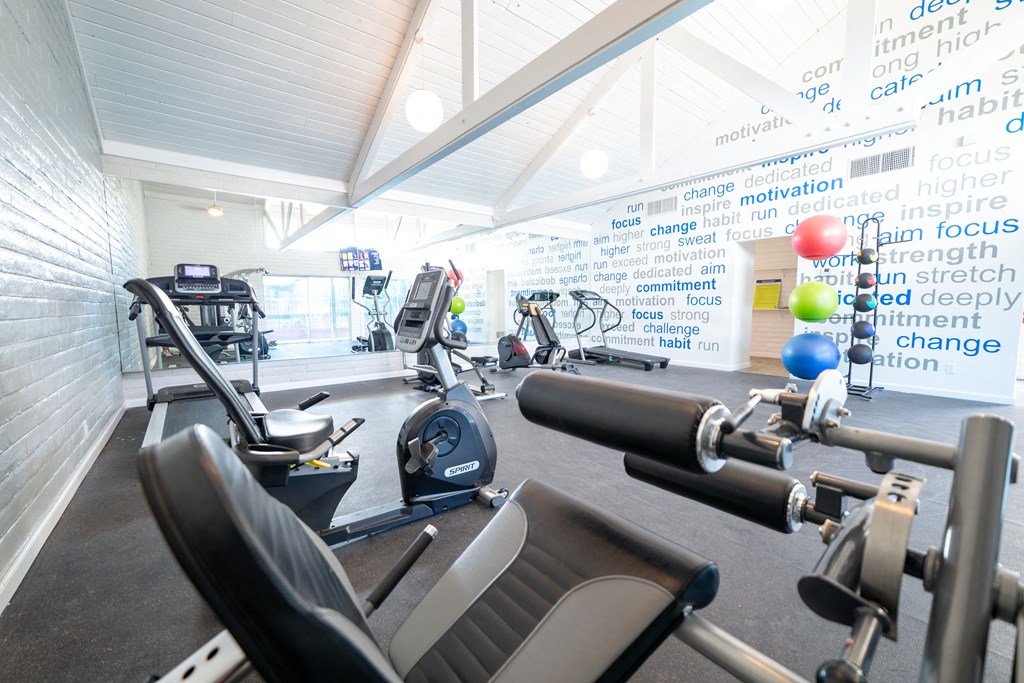 a spacious gym with cardio equipment and weights a spacious gym with cardio equipment and weights at DESERT PEAKS, EL PASO, 79912