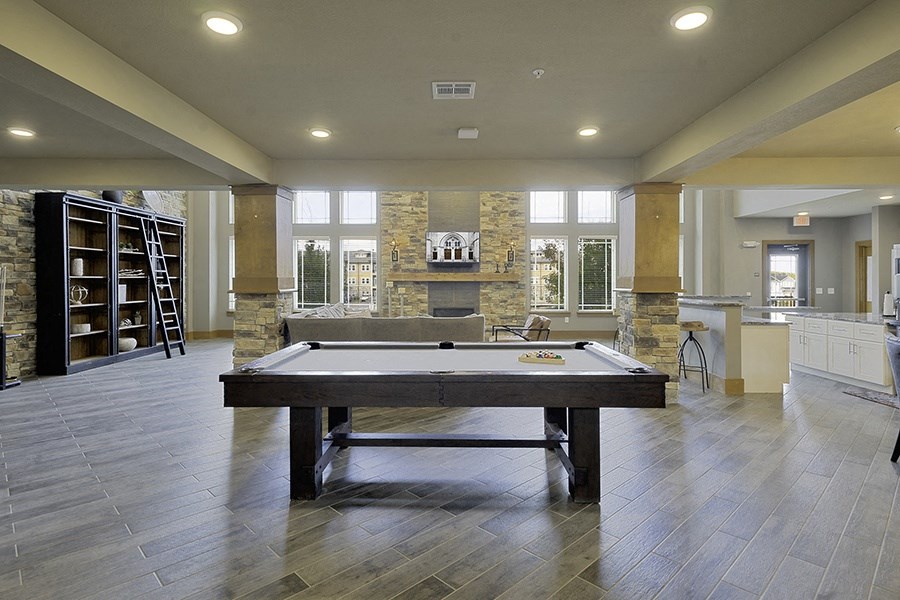 Community lunge and game room with pool