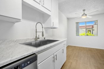 Kitchen with wood floors near dining area and window - Photo Gallery 6