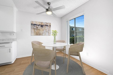 Dining area with wood floors and window