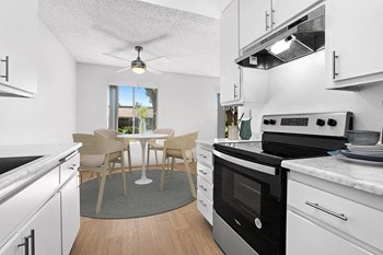 Kitchen with appliances and wood floors - Photo Gallery 2