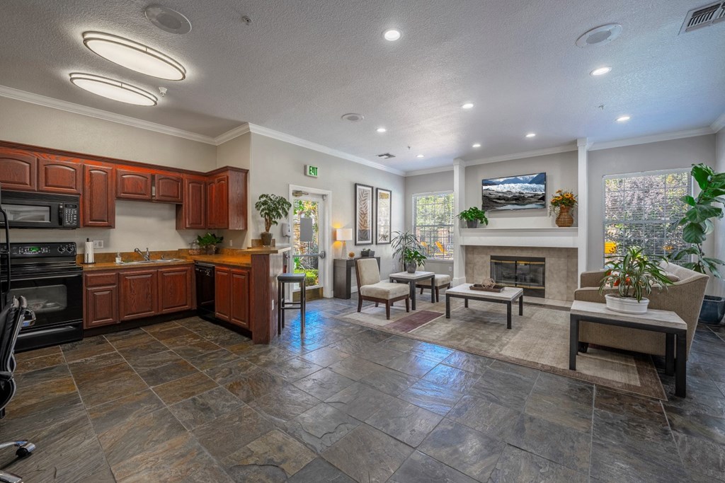 a resident clubhouse with a kitchen and living room