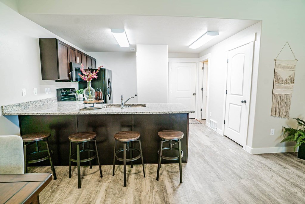 a view of a dining room with a table and chairs at Arcadia Townhomes, Roy, 84067