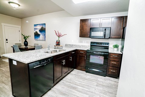 a kitchen with stainless steel appliances and a counter top