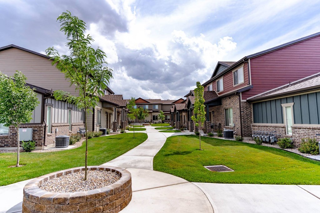 a view of a park with a fountain at Arcadia Townhomes, Roy, UT 84067
