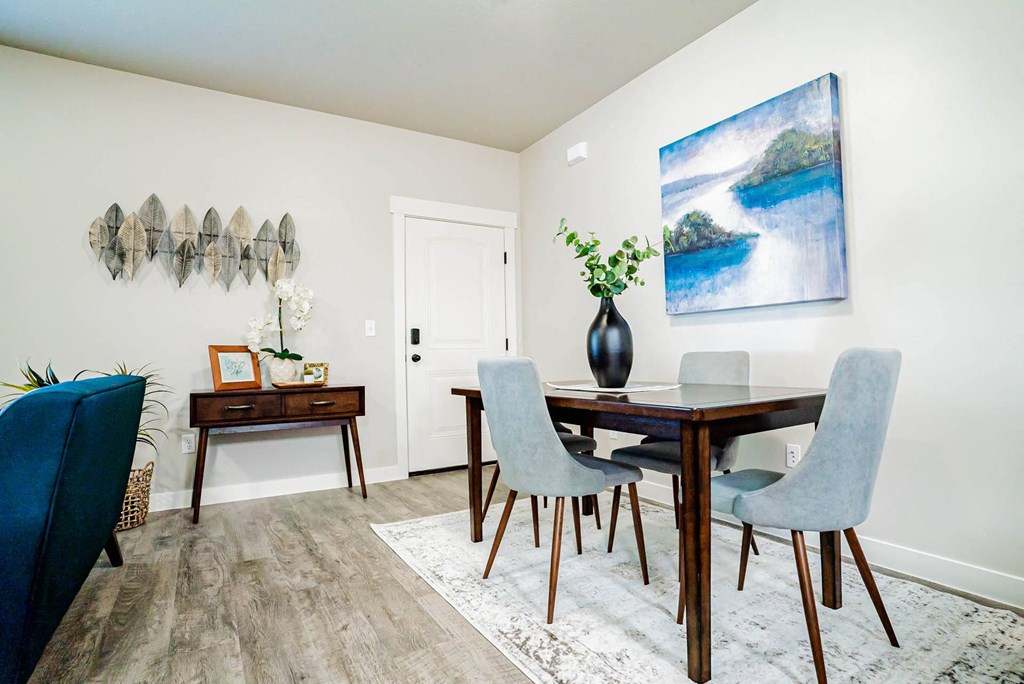 a dining room with a table and chairs at Arcadia Townhomes, Roy, 84067