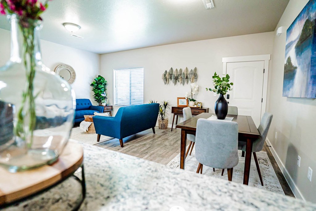 a living room and dining room with a table and chairs at Arcadia Townhomes, Utah, 84067