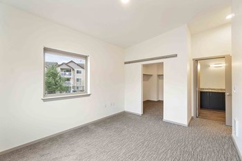 Crescent Point bedroom with carpeting and large closet - Photo Gallery 10