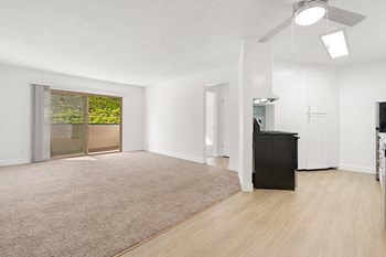 Kitchen and living room with patio Nimitz Pointe Apartments - Photo Gallery 5