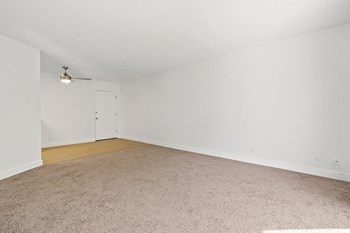 Living room area with carpet Nimitz Pointe Apartments - Photo Gallery 6