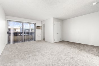 Carpeted living room with patio - Photo Gallery 5