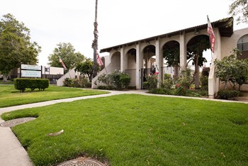Front entry to community with sign - Photo Gallery 6