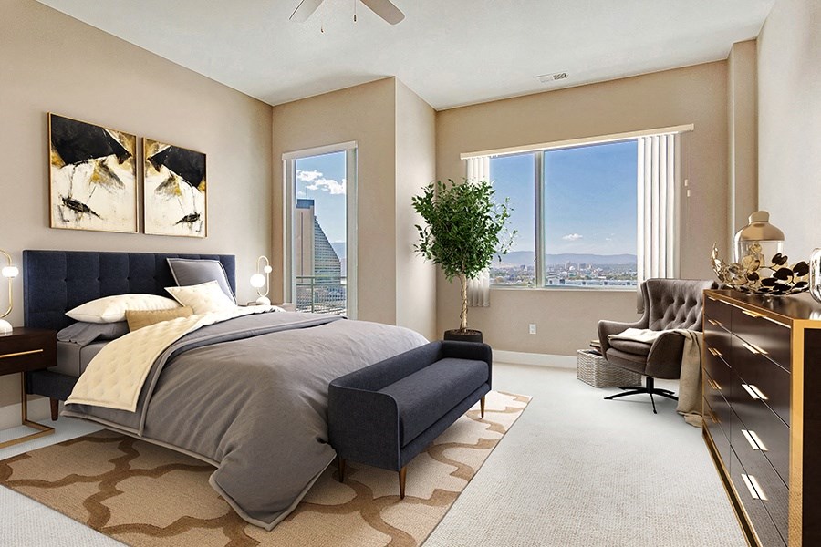Penthouse bedroom with a window