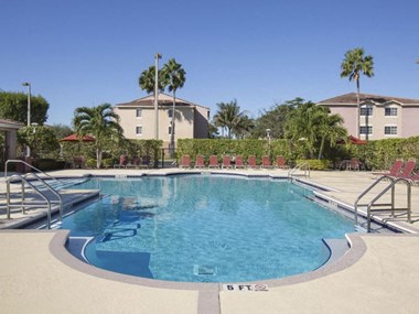 Pool with lounge chairs Doral Terrace in Doral Florida