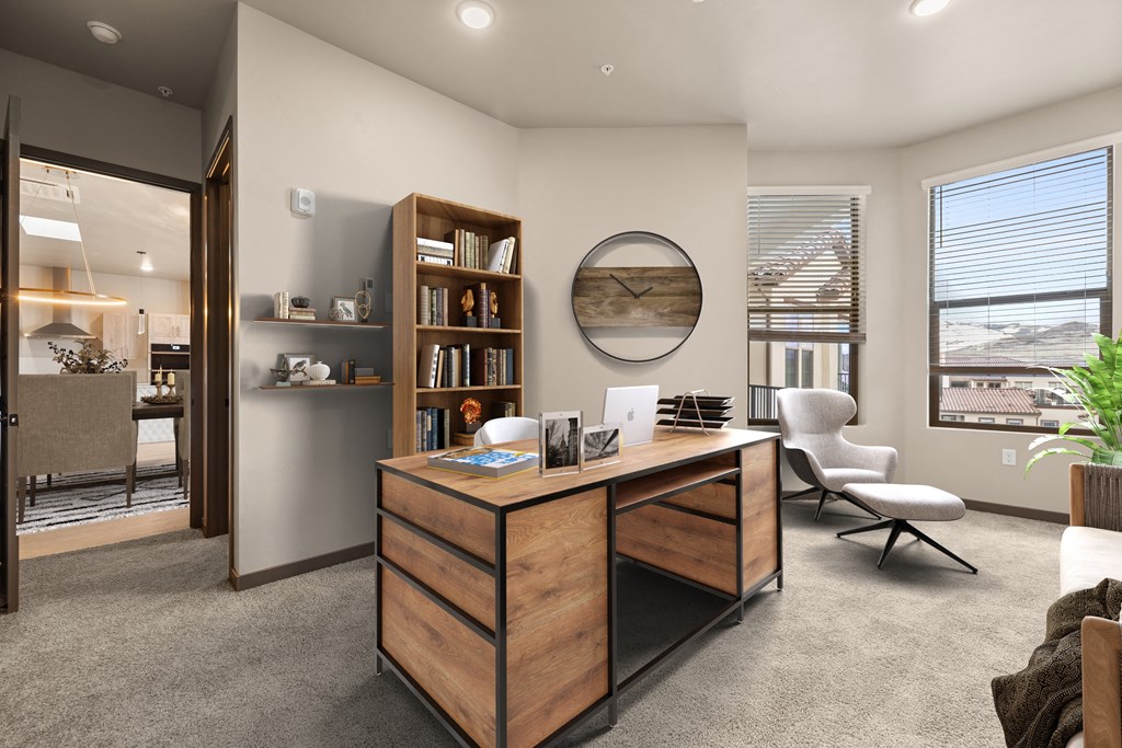 a home office with a wooden desk and a round mirror on the wall