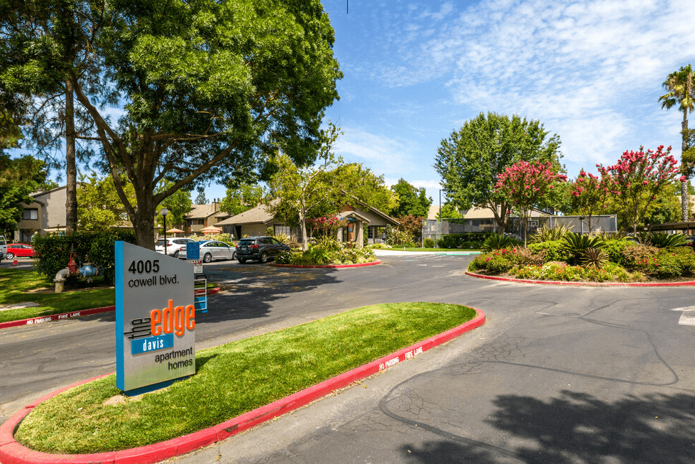 Entry to community with sign  l The Edge Apartments in Davis, CA