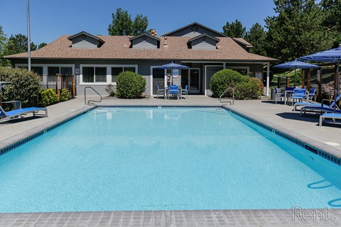 a swimming pool with a building in the background