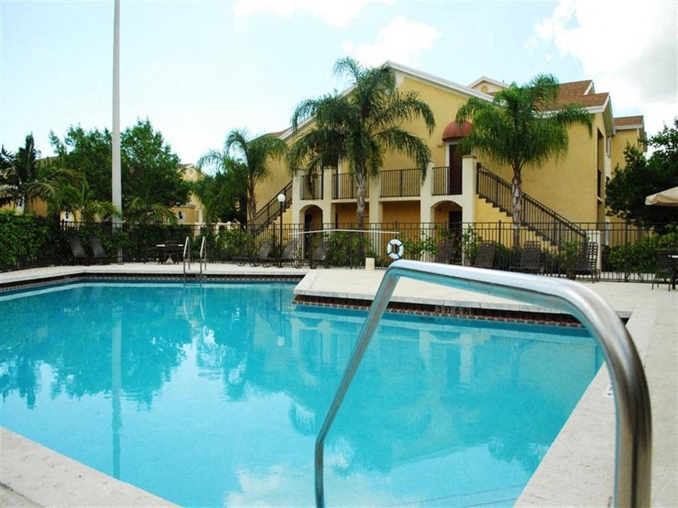 Large pool with seating Alhambra Cove Apartments in Miami Florida