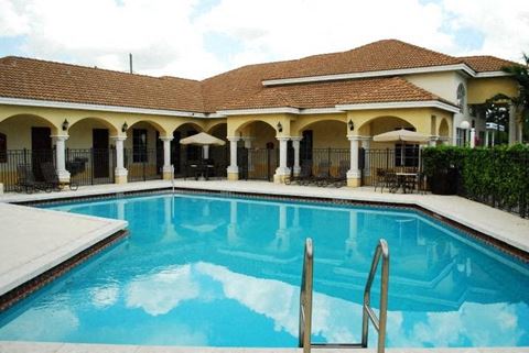 Large pool with seating Alhambra Cove Apartments in Miami Florida