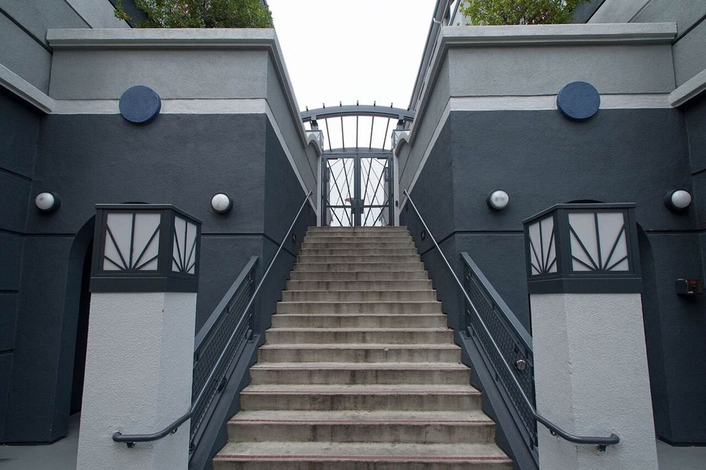a flight of stairs leading up to a building at K Street Flats, Berkeley 