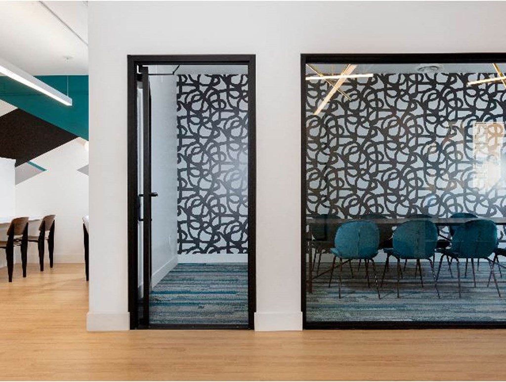 a room with a table and chairs in it at K Street Flats, Berkeley California