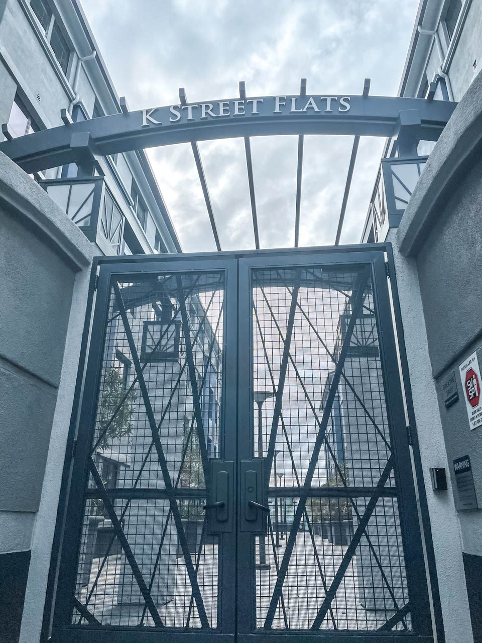 a wrought iron gate with a sign that reads k street flats at K Street Flats, Berkeley, CA