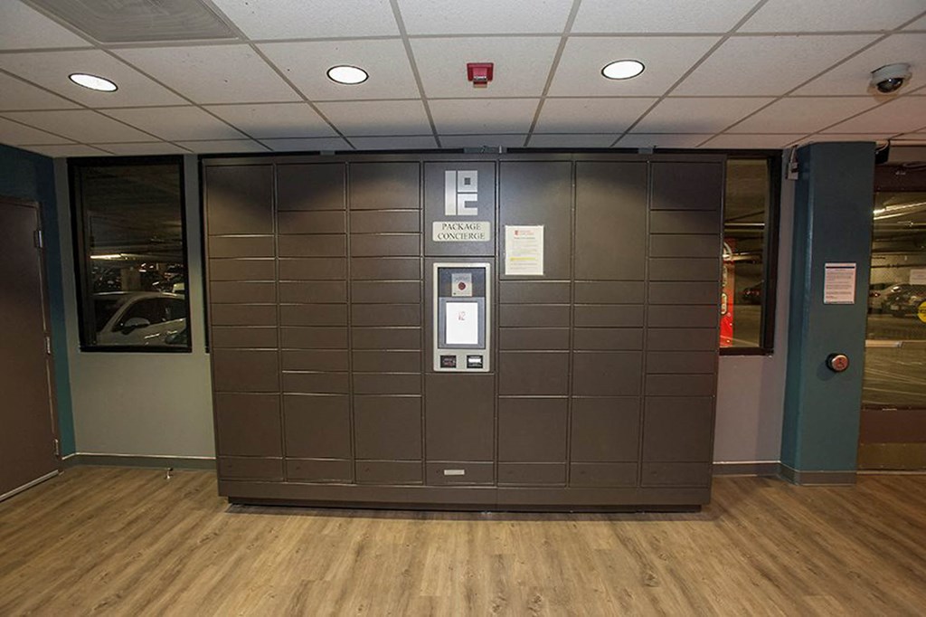 a large brown door in a room with a wooden floor at K Street Flats, Berkeley, 94704 