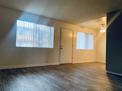 Living room with window view to door 