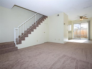 Living room with view of stairs - Photo Gallery 5
