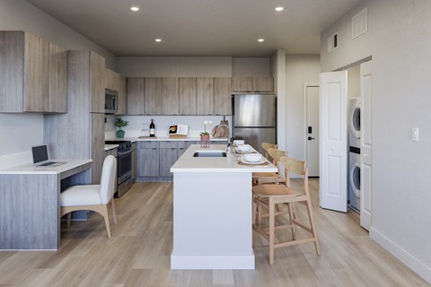 A modern kitchen with wooden cabinets and a white island.