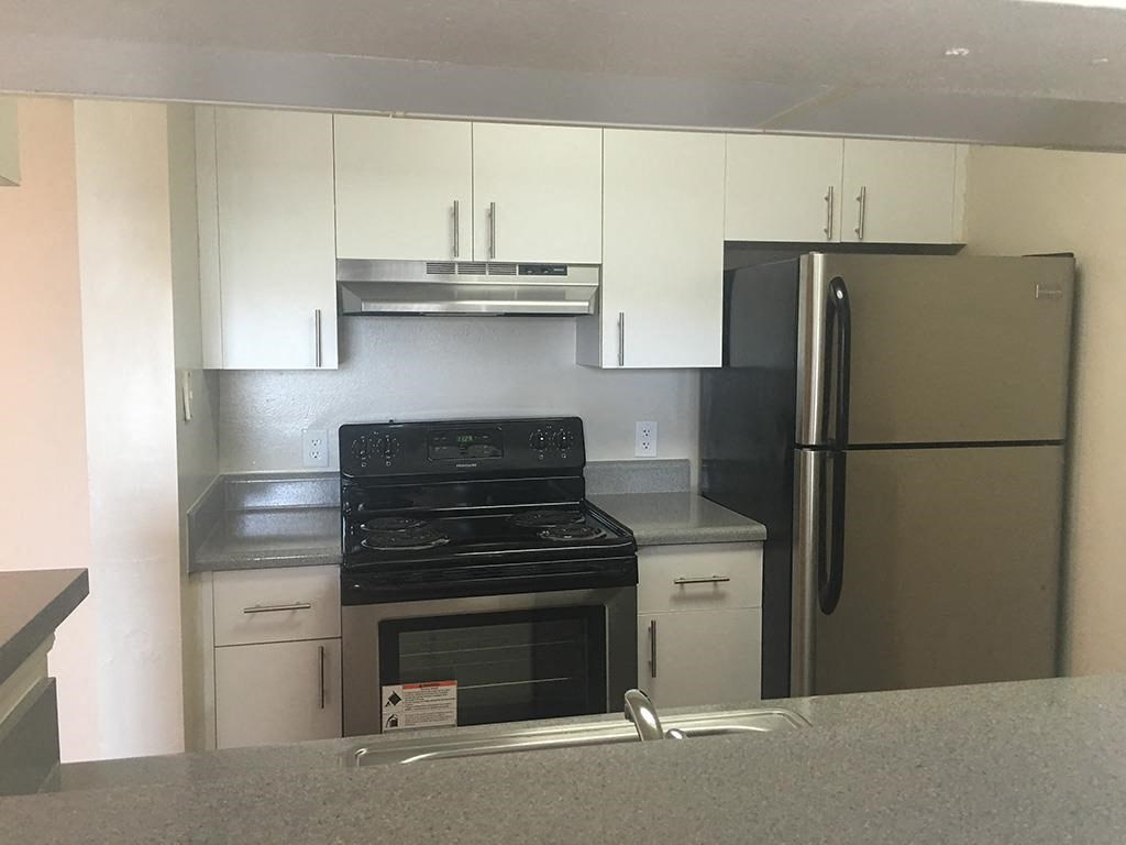 The Edge at Town Center white kitchen cabinets and stainless steel appliances