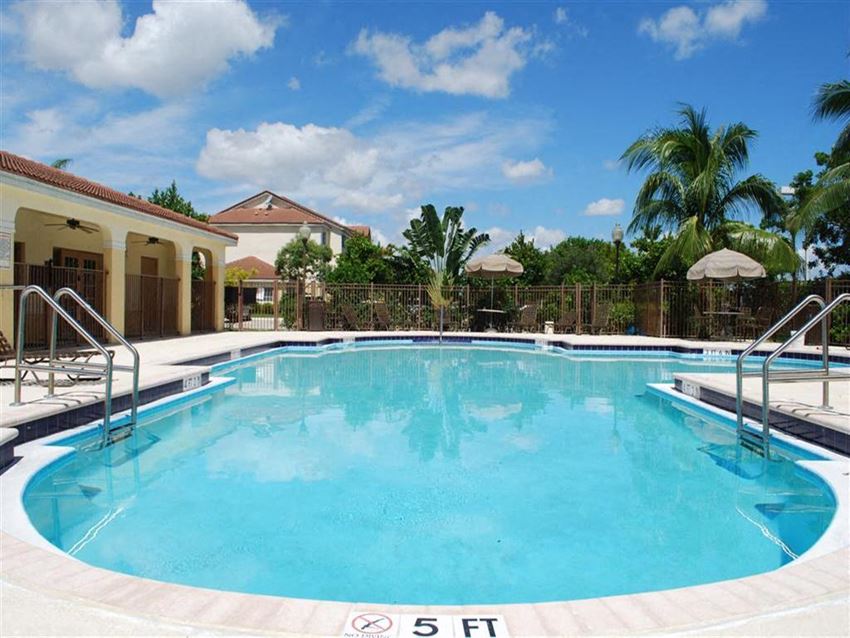 Pool with lounge chairs Eagles Pointe in Pompano Beach Florida - Photo Gallery
