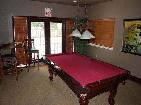 a red pool table in a living room