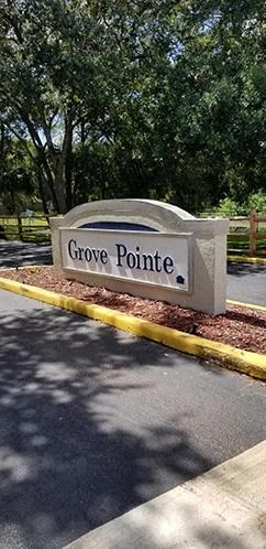 Monument sign at entry Grove Pointe Apartments Ruskin Florida
