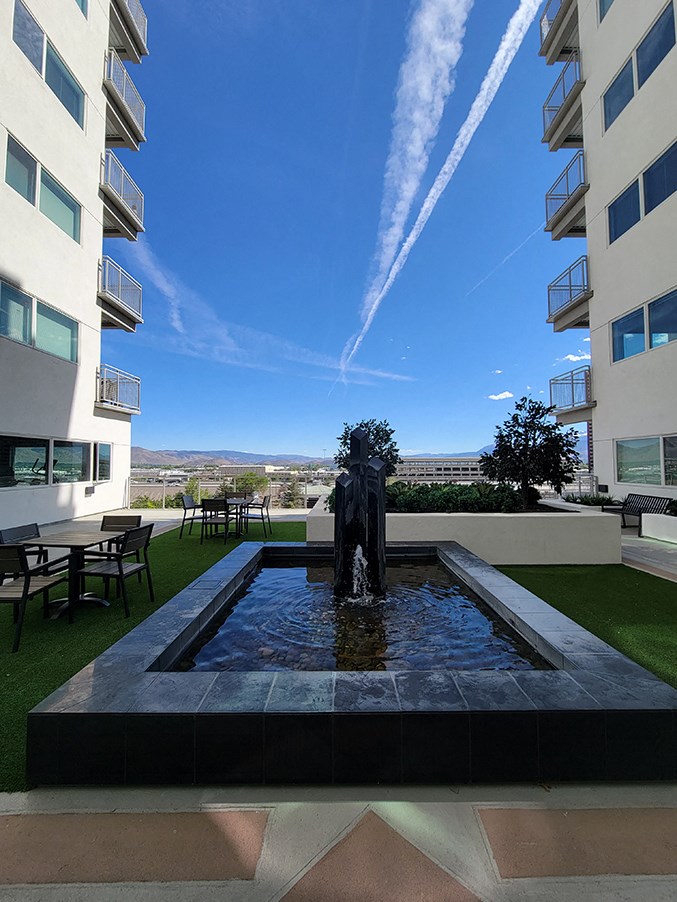 Two-BR Apartments in Sparks, NV - The Deco - Solarium Garden with Water Fountain Feature, Tables, and Chairs