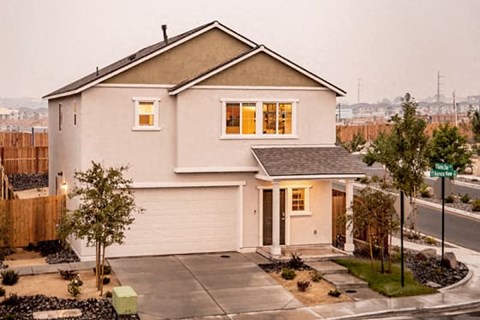 Reno, NV, Homes For Rent - Aspen Vista At Anchor Pointe - Exterior View Of House With Driveway And Maintained Landscaping.