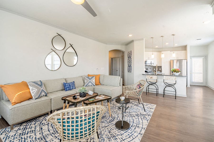 Living room with wood floors by kitchen 