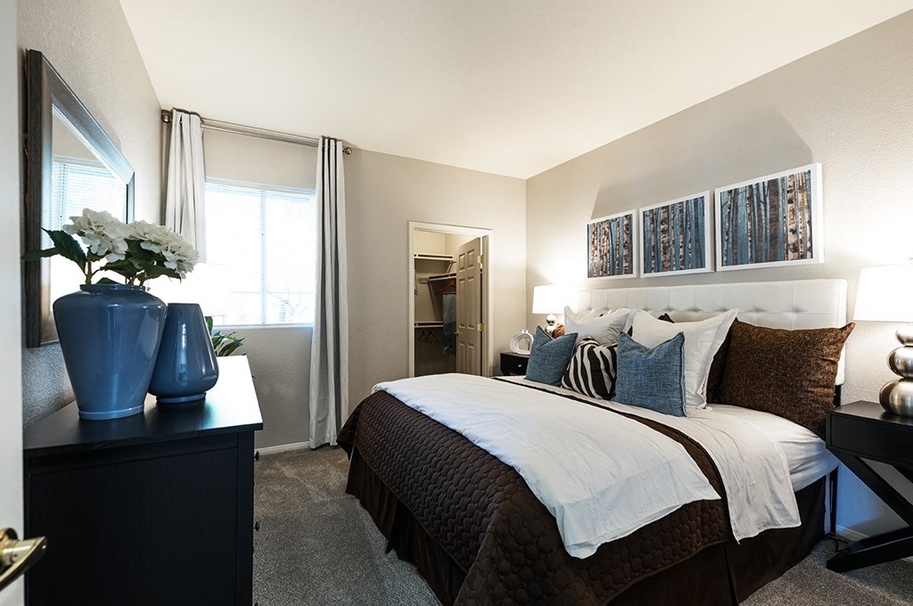 Bedroom with window and closet at THE PARKSIDE VILLAS APARTMENT HOMES, Las Vegas, Nevada