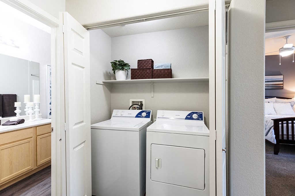 Washer and dryer area with shelf at THE PARKSIDE VILLAS APARTMENT HOMES, Las Vegas, 89123
