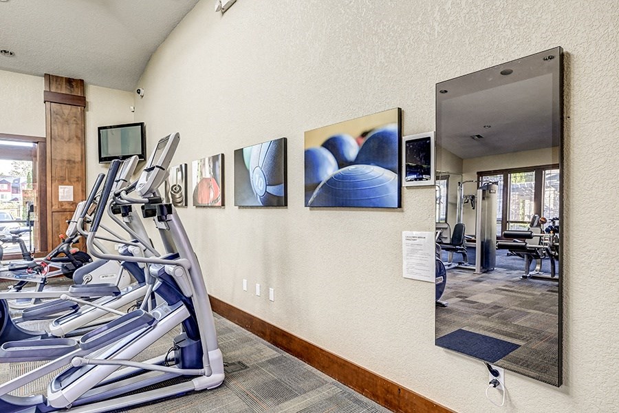 Gym with cardio equipment at BELLA SONOMA, Fife Washington