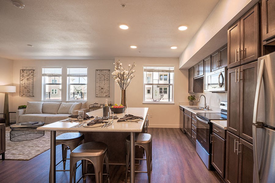 Chico, CA Apartments - Kitchen with Stinless Steel Appliances, Wood Flooring, and Island, and Window