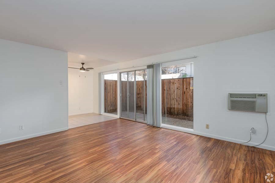 2x1 living area with wood floors and patio