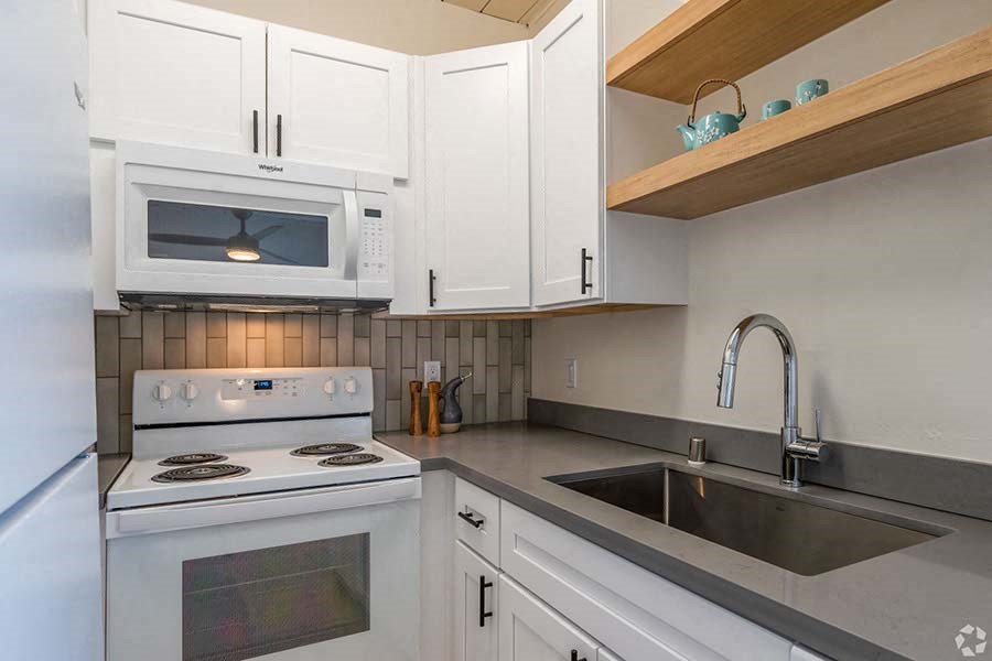 Mountain View Apartments - Glenwood Garden - Kitchen With a Microwave, an Oven, Sleek Counters, and Spacious Cabinets