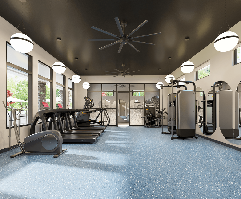 A gym with treadmills, weights, and exercise equipment at Ranches at Gunsmoke, Maricopa, AZ 85138