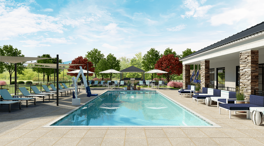 A large swimming pool surrounded by lounge chairs and umbrella at Ranches at Gunsmoke, AZ, 85138