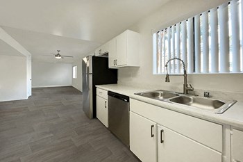 Kitchen with appliances and wood floors - Photo Gallery 2