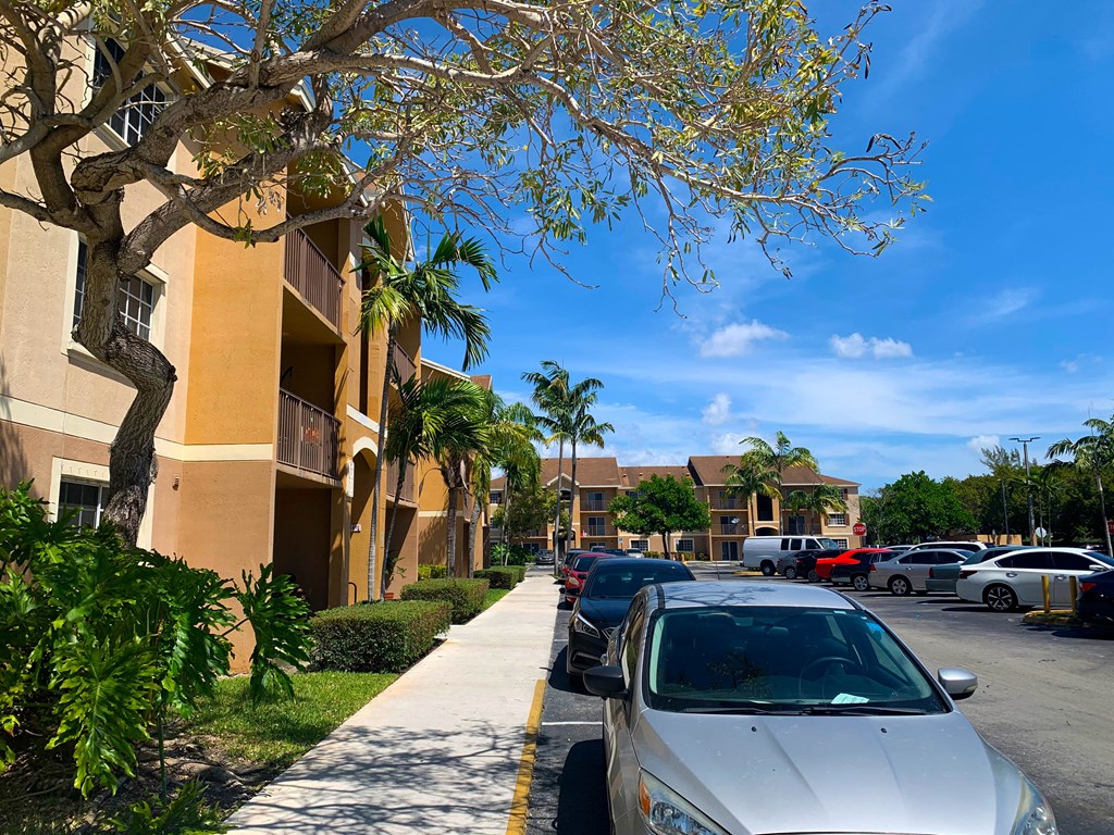 Parking near sidewalk and building at Hibiscus Pointe, Miami, FL