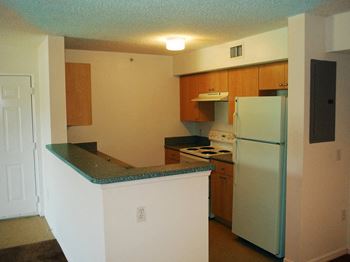 Kitchen with appliances at Hibiscus Pointe, Miami